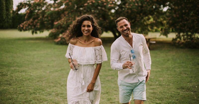 Couple outdoor laughing — Marriage Month 2026